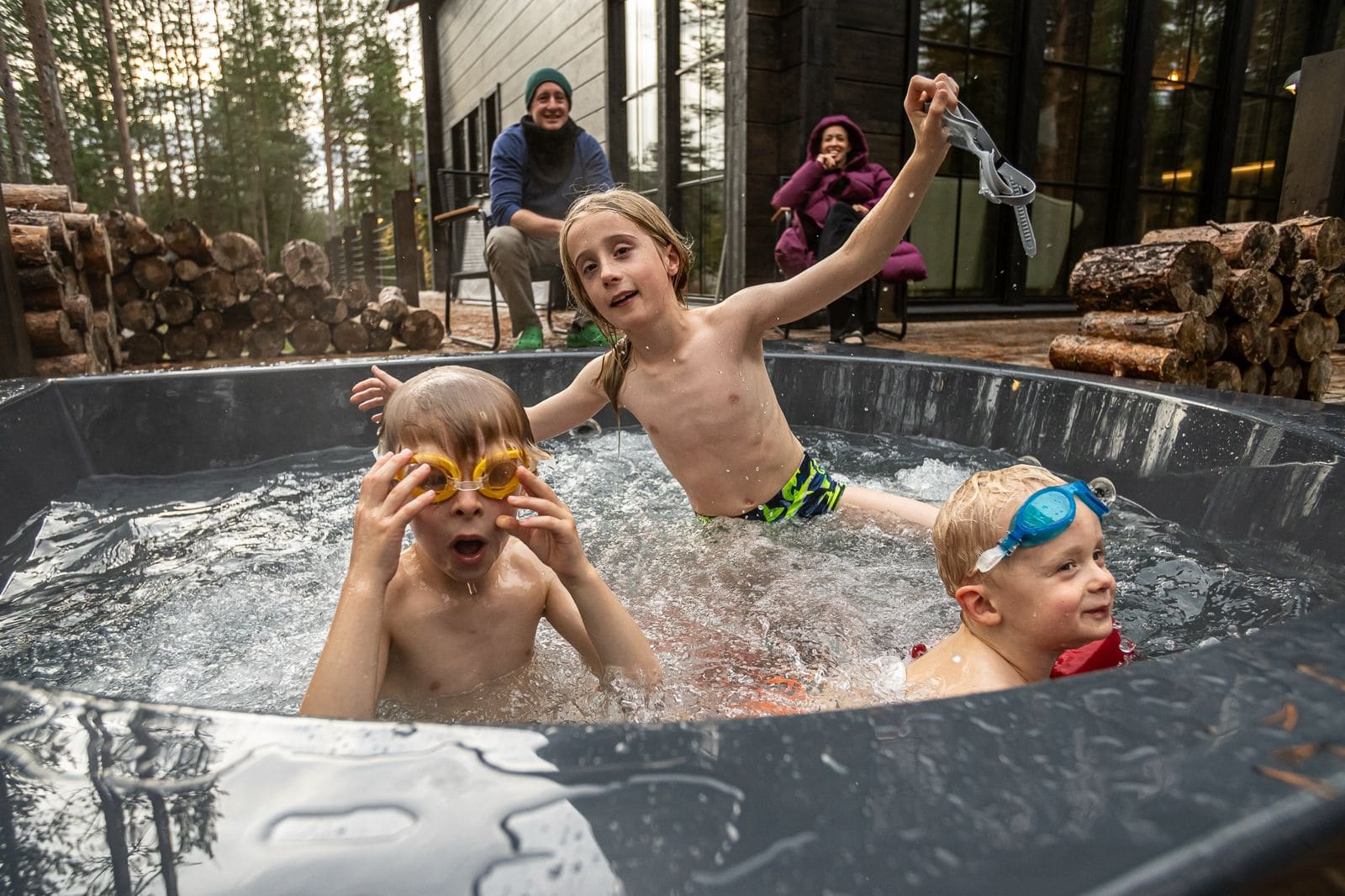 Outdoor hot tub sauna experience in snowy Lapland winter
