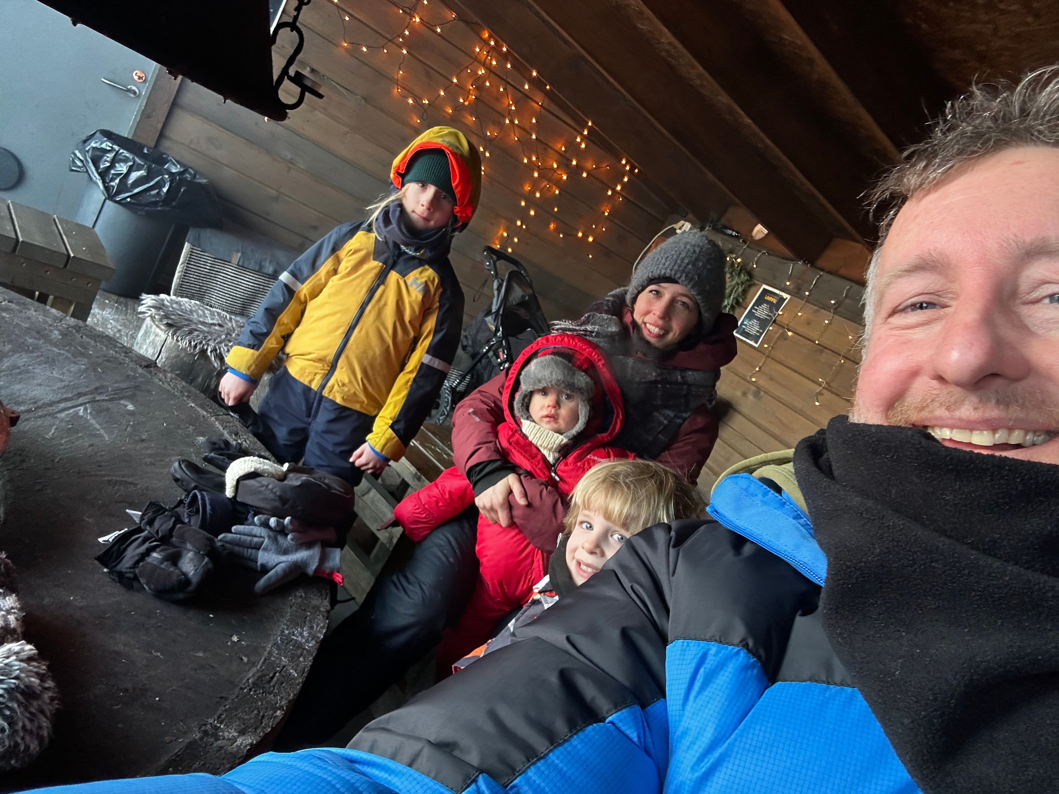 Family in winter gear in Finnish Lapland — outdoor adventure